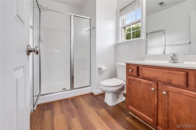 2909 Ginter St, Henrico, VA 23228 - bathroom featuring a shower stall, toilet, wood finished floors, and vanity