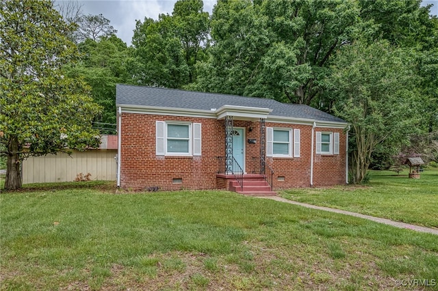 27 Medlock Rd, Sandston, VA 23150 - view of front of property featuring crawl space, brick siding, a front lawn, and roof with shingles