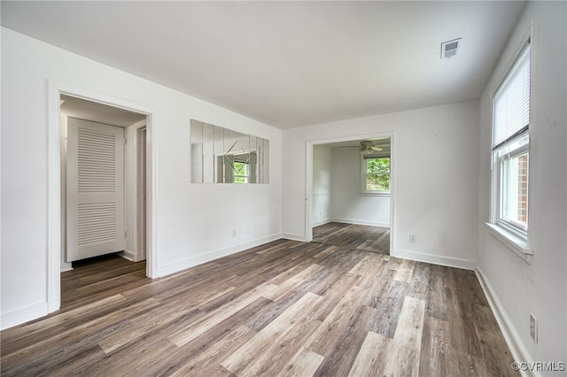 27 Medlock Rd, Sandston, VA 23150 - empty room featuring wood finished floors, healthy amount of natural light, ceiling fan, and baseboards