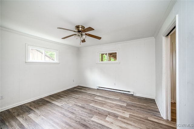 27 Medlock Rd, Sandston, VA 23150 - spare room with a baseboard radiator, healthy amount of natural light, ornamental molding, wood finished floors, and a ceiling fan
