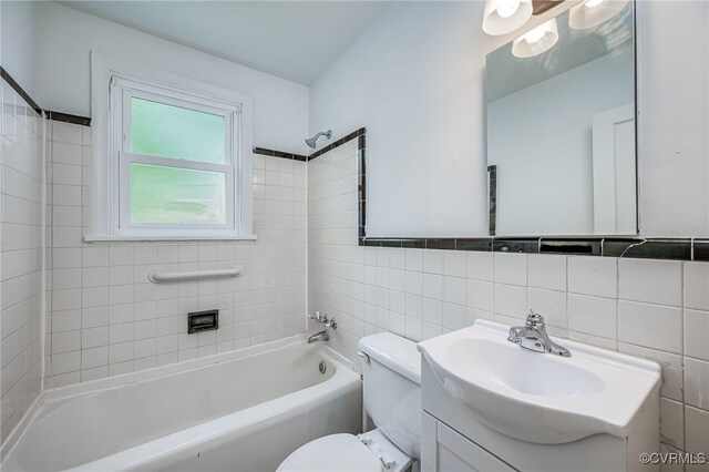 27 Medlock Rd, Sandston, VA 23150 - bathroom featuring tile walls, toilet, shower / bathtub combination, and vanity