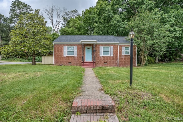 27 Medlock Rd, Sandston, VA 23150 - view of front of house with a front yard, brick siding, a chimney, and crawl space