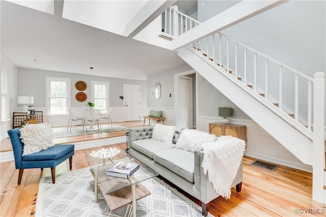 5905 Willow Creek Way, Richmond, VA 23225 - living area featuring stairway, wood finished floors, and a wainscoted wall