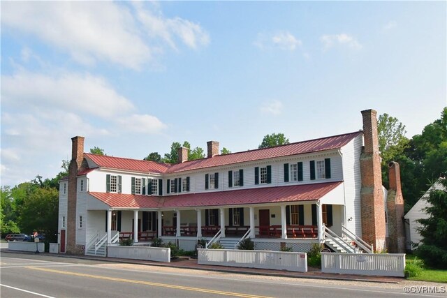 12387 Hanover Courthouse Rd, Hanover, VA 23069 - view of front facade with a chimney, a porch, metal roof, and stairway