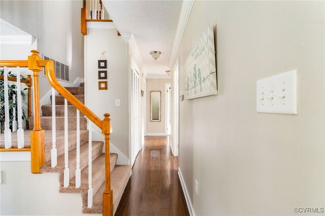 12387 Hanover Courthouse Rd, Hanover, VA 23069 - staircase featuring wood finished floors, crown molding, baseboards, and a textured ceiling