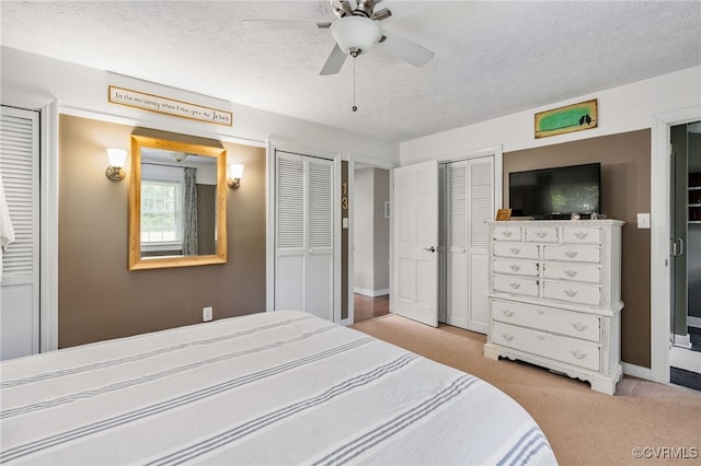12387 Hanover Courthouse Rd, Hanover, VA 23069 - bedroom with carpet floors, a textured ceiling, baseboards, two closets, and ceiling fan