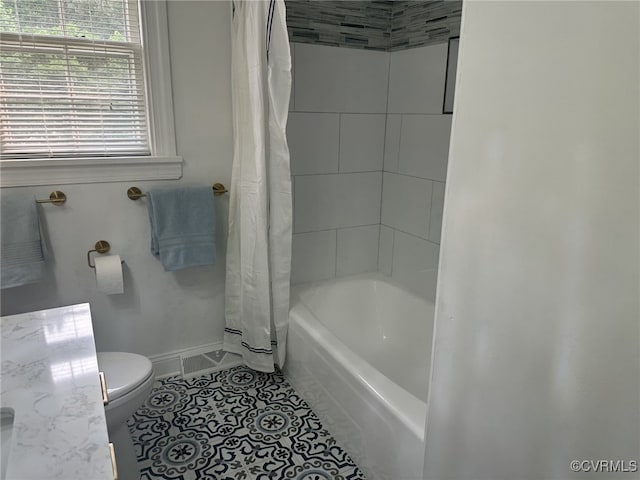 9079 Cudlipp Ave, Mechanicsville, VA 23116 - bathroom with toilet, tile patterned flooring, shower / tub combo, and baseboards