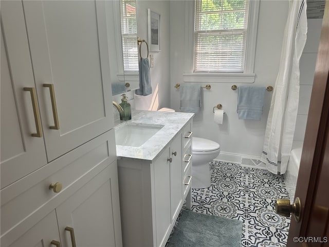 9079 Cudlipp Ave, Mechanicsville, VA 23116 - full bath featuring vanity, toilet, baseboards, and plenty of natural light