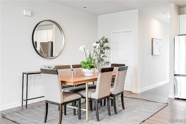 1900 Roseneath Rd Unit 9A, Richmond, VA 23230 - dining room featuring wood finished floors and baseboards