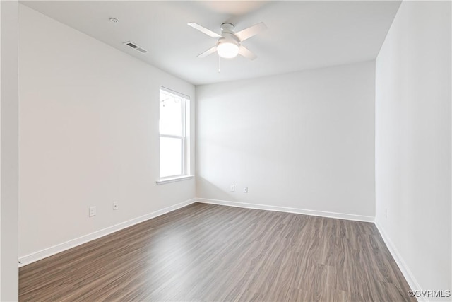 1900 Roseneath Rd Unit 9A, Richmond, VA 23230 - spare room with dark wood-type flooring, a ceiling fan, and baseboards