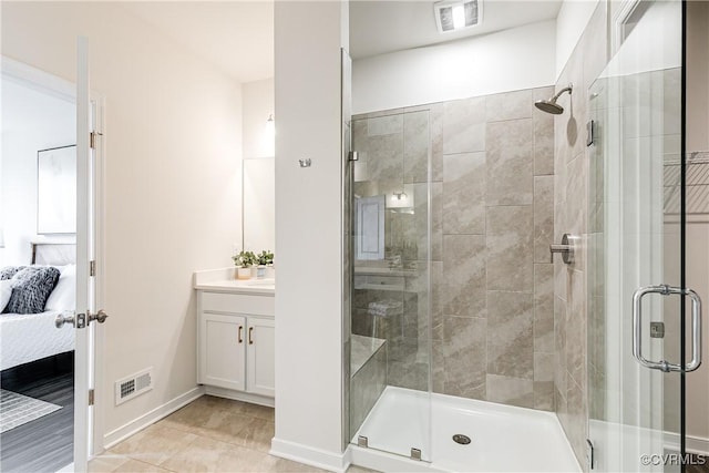 1900 Roseneath Rd Unit 9A, Richmond, VA 23230 - bathroom with ensuite bath, vanity, a shower stall, tile patterned floors, and baseboards