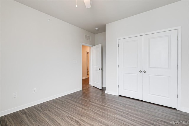 1900 Roseneath Rd Unit 9A, Richmond, VA 23230 - unfurnished bedroom featuring wood finished floors, baseboards, and a closet
