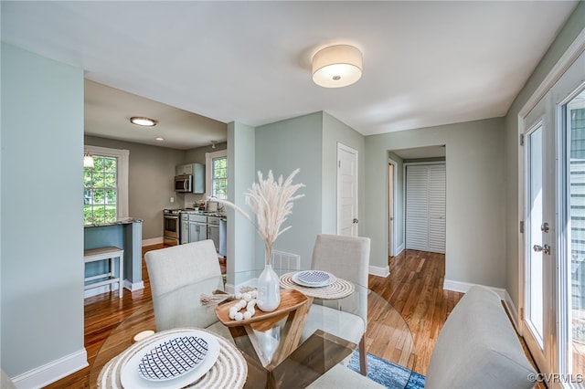 524 Highland Ave, Colonial Heights, VA 23834 - dining area featuring baseboards and wood finished floors