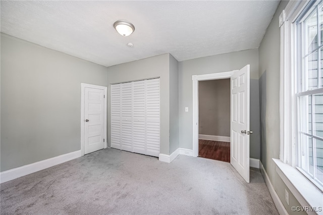 524 Highland Ave, Colonial Heights, VA 23834 - unfurnished bedroom featuring carpet, baseboards, and a closet