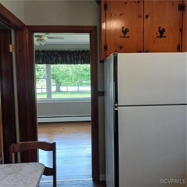 4846 Stanley Dr, Chesterfield, VA 23234 - kitchen featuring freestanding refrigerator, a baseboard heating unit, and wood finished floors
