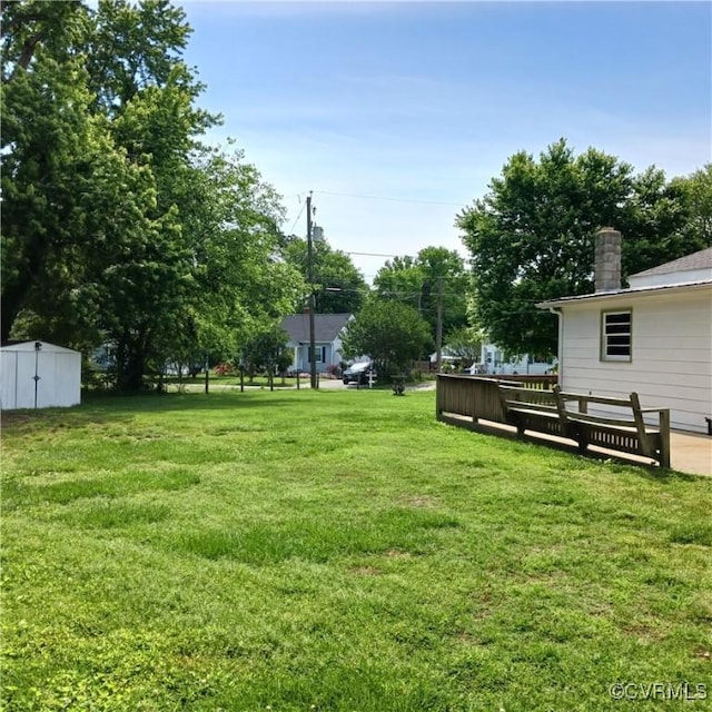 4846 Stanley Dr, Chesterfield, VA 23234 - view of grassy yard with a storage unit and a deck