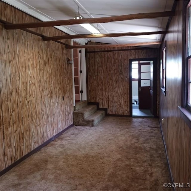 4846 Stanley Dr, Chesterfield, VA 23234 - unfurnished living room with wood walls, carpet flooring, and stairway
