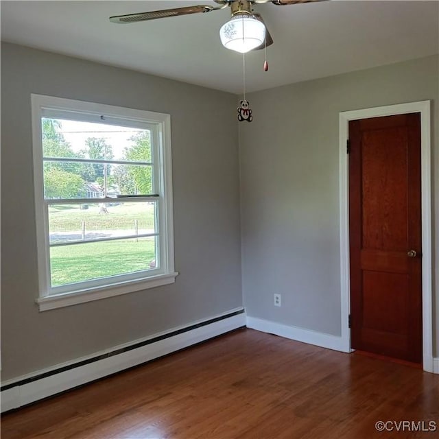 4846 Stanley Dr, Chesterfield, VA 23234 - empty room with a baseboard heating unit, a ceiling fan, and wood finished floors