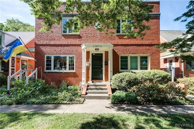view of front of property featuring brick siding