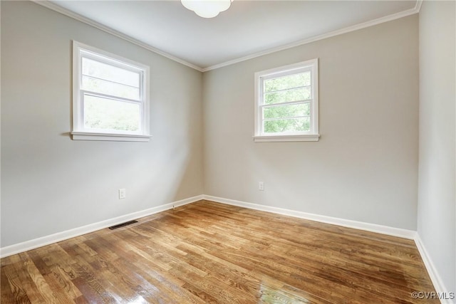 1909 N 28th St, Richmond, VA 23223 - empty room with crown molding, baseboards, and wood finished floors
