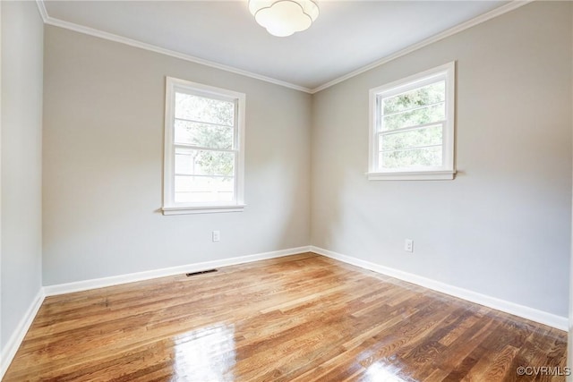 1909 N 28th St, Richmond, VA 23223 - empty room with wood finished floors, baseboards, and crown molding