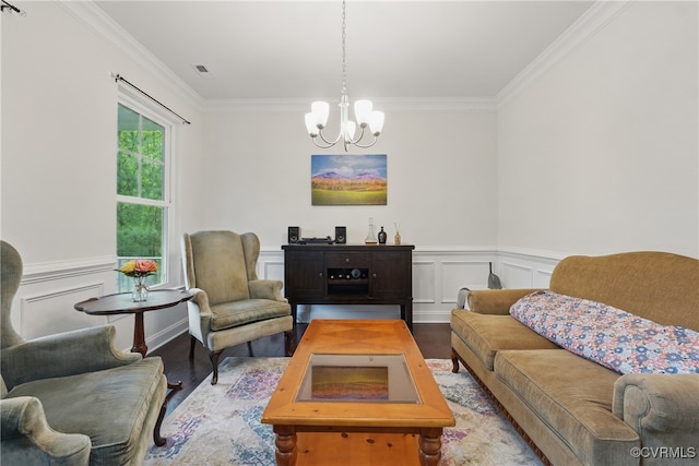 5681 Saint Leger Dr, Providence Forge, VA 23140 - living room with wood finished floors, a chandelier, ornamental molding, and a wainscoted wall