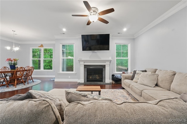5681 Saint Leger Dr, Providence Forge, VA 23140 - living room featuring ceiling fan, wood finished floors, baseboards, a fireplace with flush hearth, and crown molding