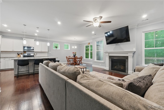 5681 Saint Leger Dr, Providence Forge, VA 23140 - living room featuring a ceiling fan, dark wood finished floors, recessed lighting, ornamental molding, and a fireplace with flush hearth