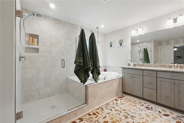 5681 Saint Leger Dr, Providence Forge, VA 23140 - bathroom with a shower stall, a garden tub, double vanity, tile patterned floors, and recessed lighting