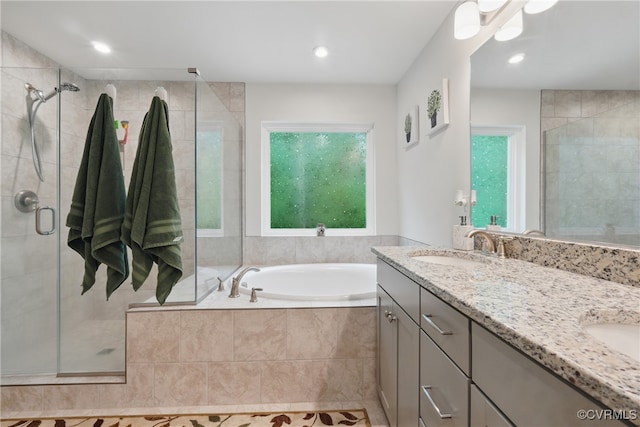 5681 Saint Leger Dr, Providence Forge, VA 23140 - full bath featuring a stall shower, a bath, double vanity, and recessed lighting