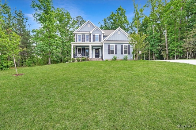 5681 Saint Leger Dr, Providence Forge, VA 23140 - view of front facade featuring a front lawn, board and batten siding, and a porch