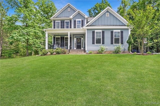 5681 Saint Leger Dr, Providence Forge, VA 23140 - view of front of property with board and batten siding, a front yard, and covered porch