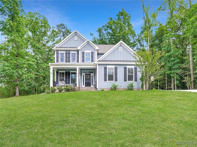 5681 Saint Leger Dr, Providence Forge, VA 23140 - view of front of property with board and batten siding, a front yard, and covered porch