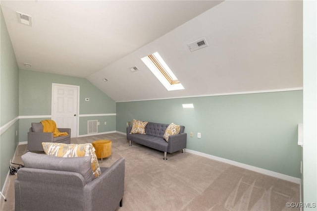 living room featuring vaulted ceiling, carpet, baseboards, and a skylight