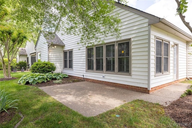 back of house with a patio