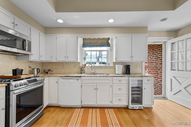 104 Peter Francisco Dr, Hopewell, VA 23860 - kitchen with stainless steel appliances, a sink, beverage cooler, white cabinets, and recessed lighting