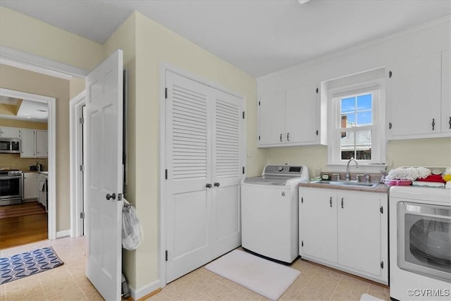 104 Peter Francisco Dr, Hopewell, VA 23860 - laundry area with cabinet space, separate washer and dryer, and baseboards