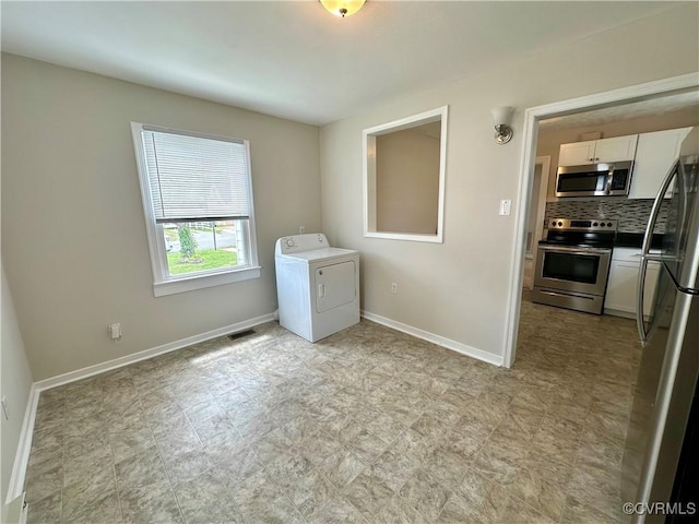 2404 Parrish St, Henrico, VA 23231 - laundry room featuring washer / clothes dryer, baseboards, and light floors