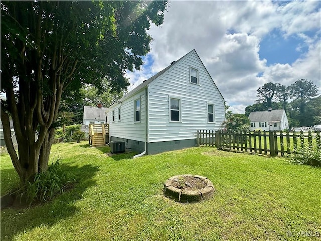 2404 Parrish St, Henrico, VA 23231 - view of home's exterior with crawl space, an outdoor fire pit, and central air condition unit