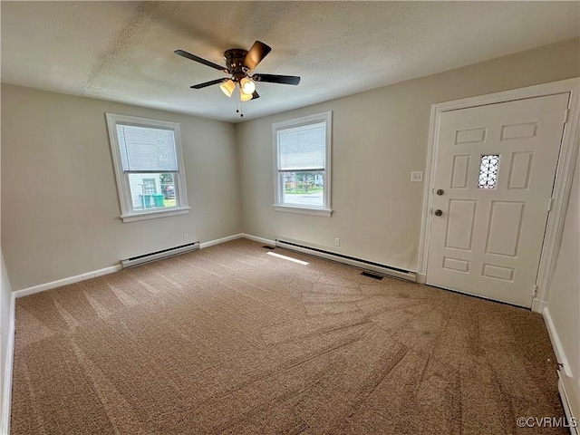 2404 Parrish St, Henrico, VA 23231 - carpeted foyer entrance with baseboard heating, baseboards, ceiling fan, and a textured ceiling