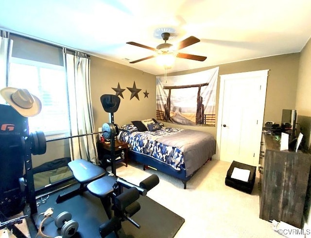 carpeted bedroom featuring a ceiling fan