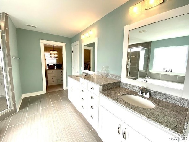 full bathroom with a stall shower, healthy amount of natural light, and a walk in closet