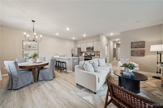 5904 Banyan Ln, Chesterfield, VA 23234 - living area featuring light wood-style floors, a chandelier, baseboards, and recessed lighting