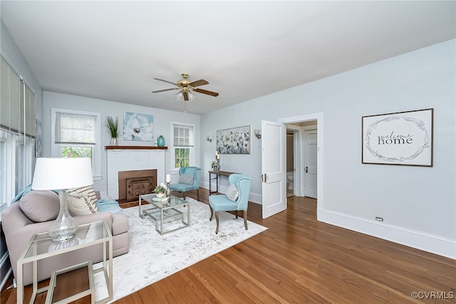 3710 W Hundred Rd, Chester, VA 23831 - living area featuring wood finished floors, a ceiling fan, baseboards, and a fireplace with flush hearth
