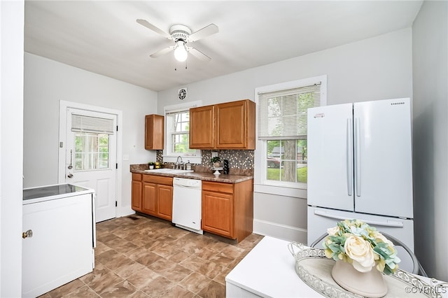 3710 W Hundred Rd, Chester, VA 23831 - kitchen with white appliances, a ceiling fan, a sink, decorative backsplash, and brown cabinetry