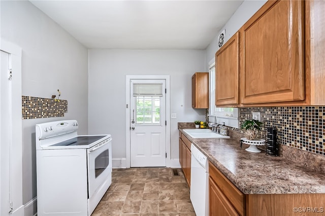 3710 W Hundred Rd, Chester, VA 23831 - kitchen with white appliances, a sink, tasteful backsplash, and brown cabinetry