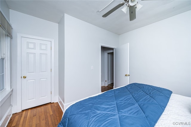 3710 W Hundred Rd, Chester, VA 23831 - bedroom with wood finished floors, a ceiling fan, and baseboards