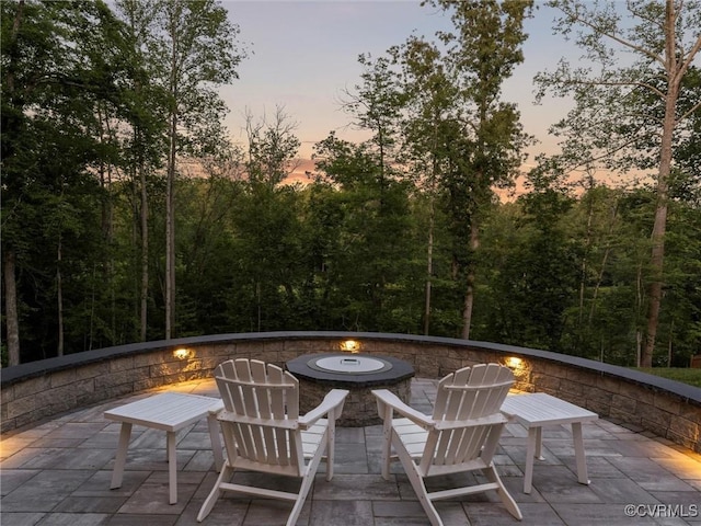 1280 Mill Quarter Rd, Powhatan, VA 23139 - patio terrace at dusk featuring a fire pit and a patio area