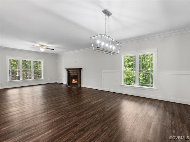 1280 Mill Quarter Rd, Powhatan, VA 23139 - unfurnished living room featuring dark wood finished floors, ceiling fan, crown molding, a warm lit fireplace, and a chandelier