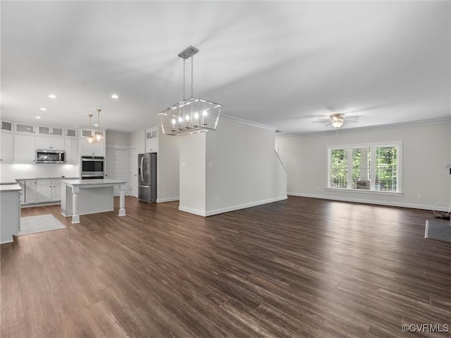 1280 Mill Quarter Rd, Powhatan, VA 23139 - unfurnished living room with ornamental molding, a ceiling fan, dark wood-style floors, recessed lighting, and a chandelier